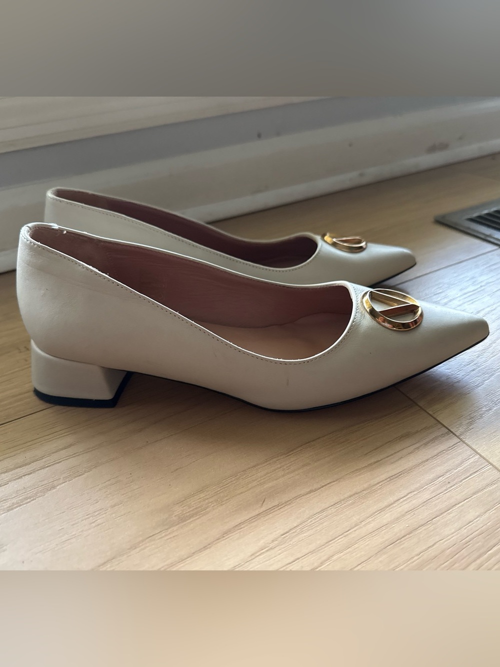 Valentino Cream Pointed Low-Heel Pumps with Gold Logo Accent